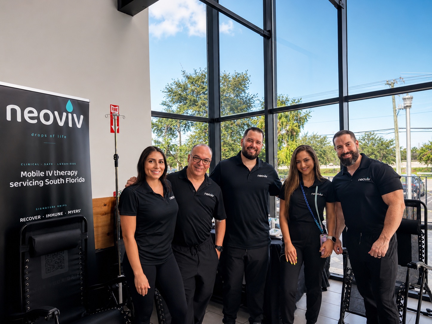 The NeoViv team standing together at a South Florida IV therapy pop-up